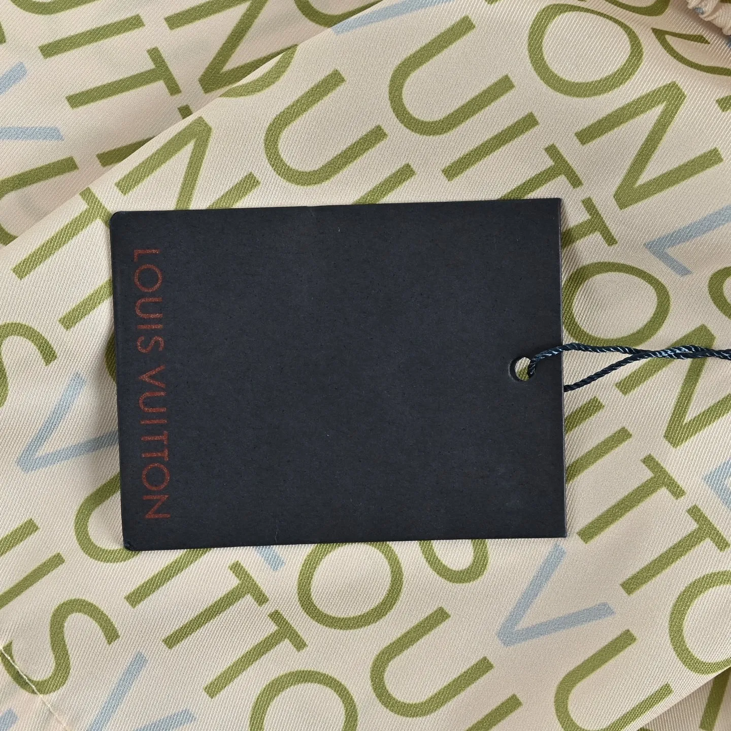 Louis Vuitton/Louis Vuitton all-over lettering suit shorts